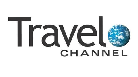 Travel Channel logo featuring the text Travel Channel with a blue globe replacing the O